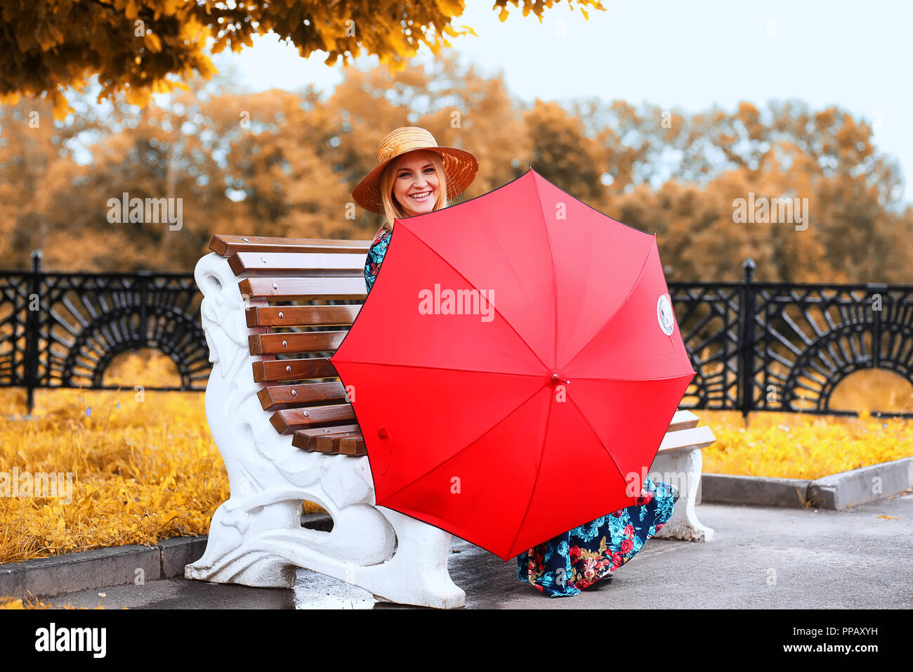 Girl in the street with an umbrella Stock Photo - Alamy