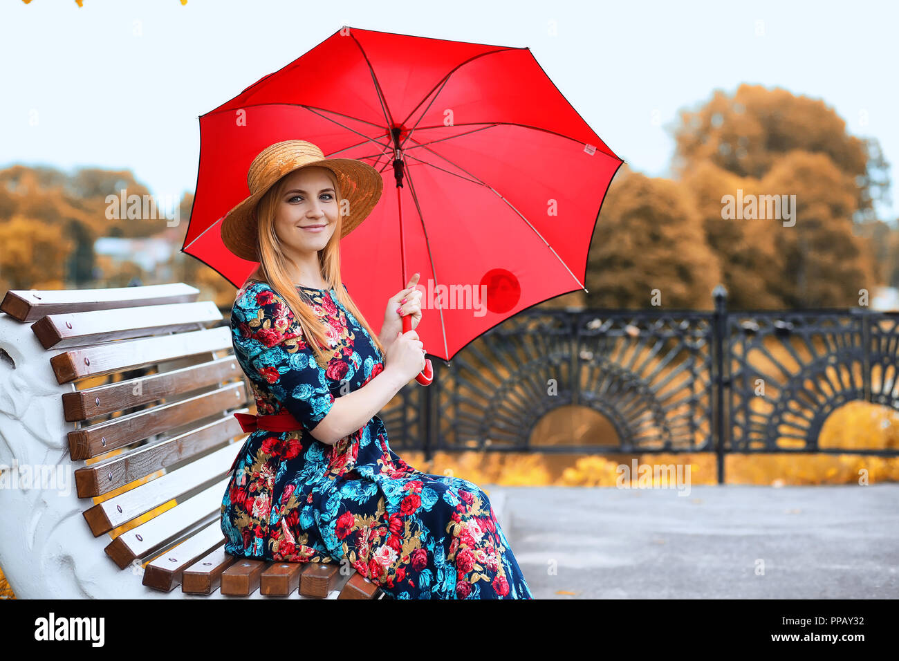 Girl in the street with an umbrella Stock Photo - Alamy