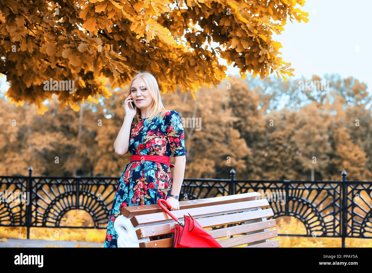 Girl in the street with an umbrella Stock Photo - Alamy