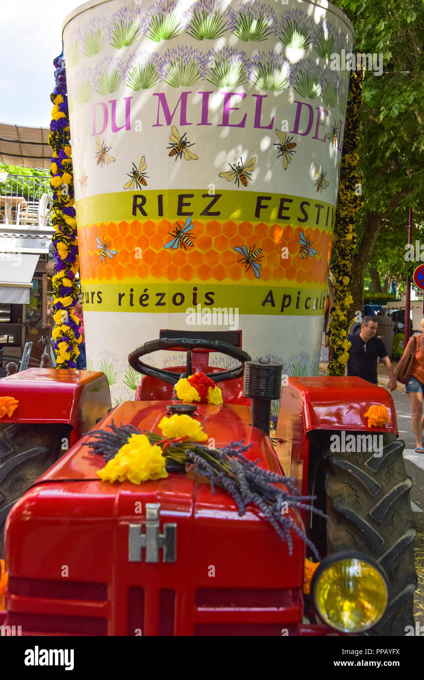 decorated tractor on the annual festival of lavender honey in Riez, Provence, France, department Alpes-de-Haute-Provence Stock Photo