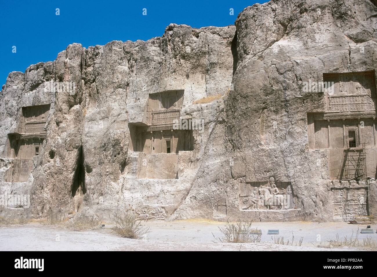Persian Art. Achaemenid Period. 6th and 5th century B.C. Tombs of kings Darius I, Xerxes I and Darius II, carved into the rock. Necropolis of Naqsh-e Rustam. Around Persepolis. Iran. Stock Photo