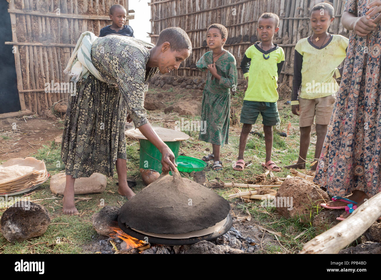 Tigray woman preparing Injera made from Teff flour & staple to diet