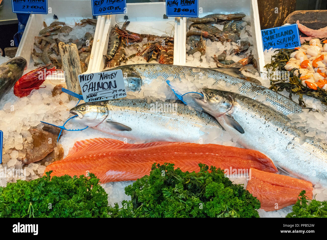 Salmon fillet and other fish and seafood for sale at a market in London Stock Photo