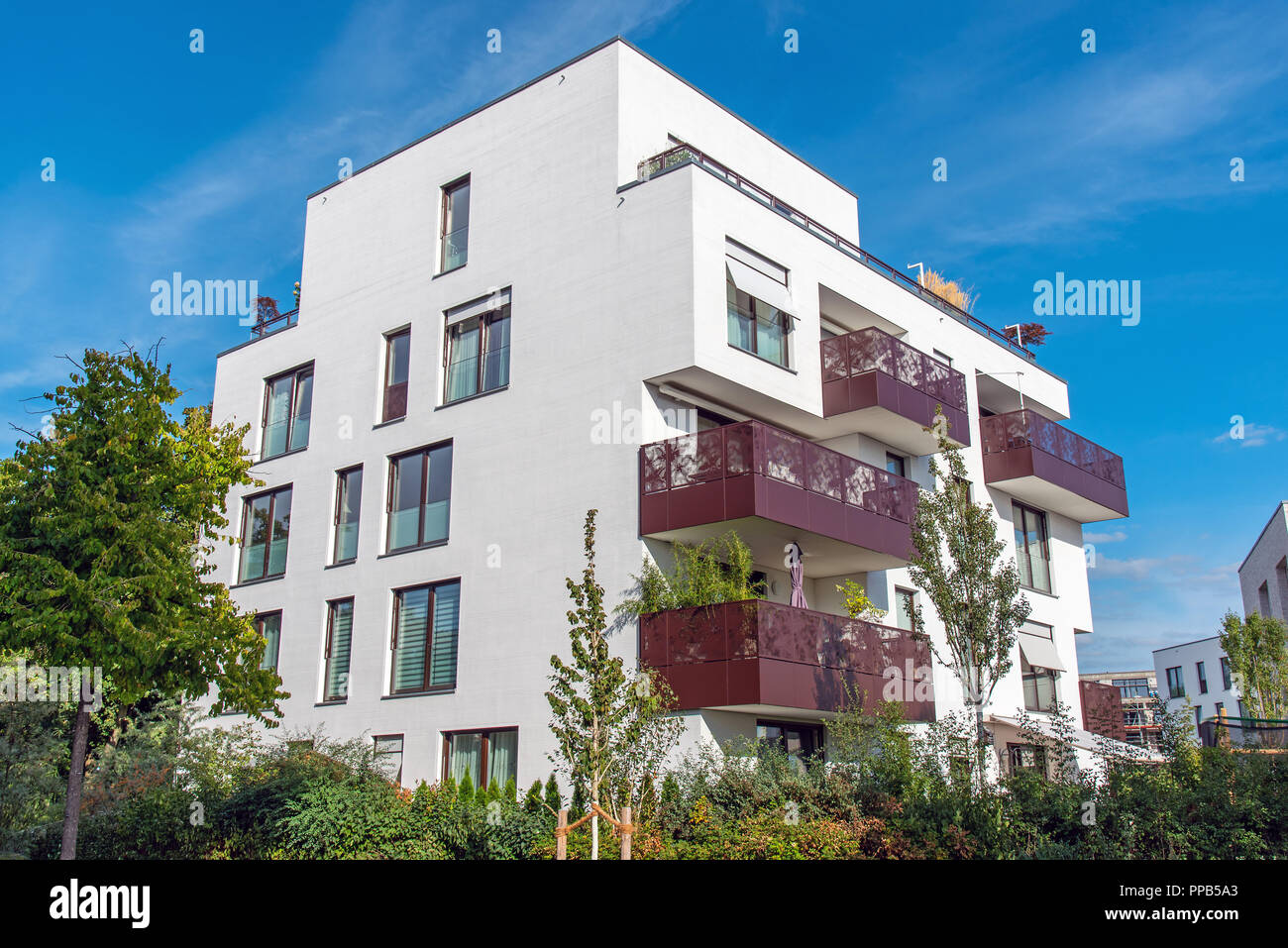 White modern apartment house with metal balconies seen in Berlin ...