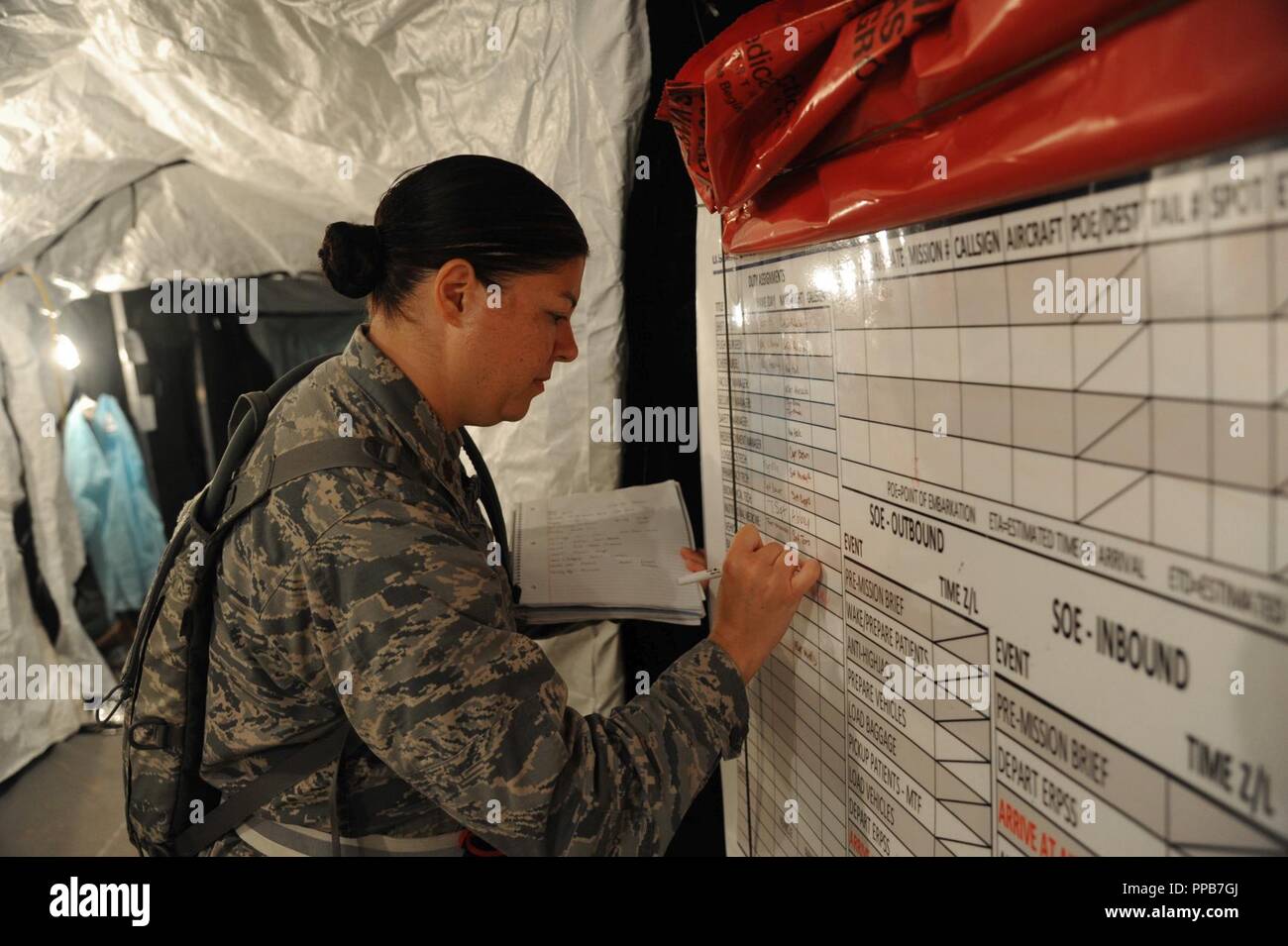 U.S. Air Force Maj. Lisa Haik, 927th Aeromedical Staging Squadron immunizations officer writes on a board in preparation for the arrival of patients during exercise Patriot Warrior on Aug. 17, 2018 at Fort McCoy, Wisc. During exercise Patriot Warrior, one aspect that the unit was evaluated for was patient movement operations. Stock Photo