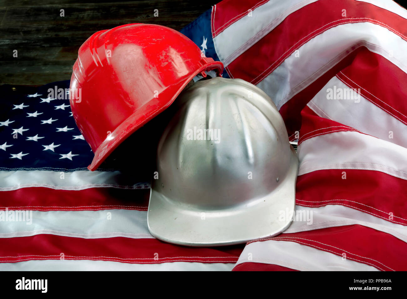 America at its greatest with flag and hard hats Stock Photo Alamy