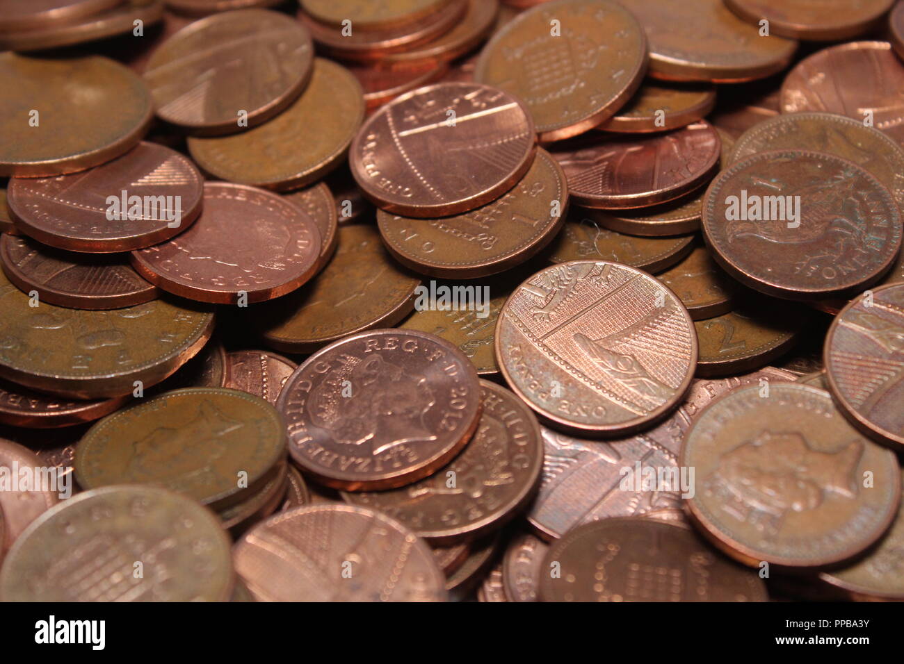 A pile of lose change British copper coins.A close up of 2p and 1p,UK coins. Stock Photo