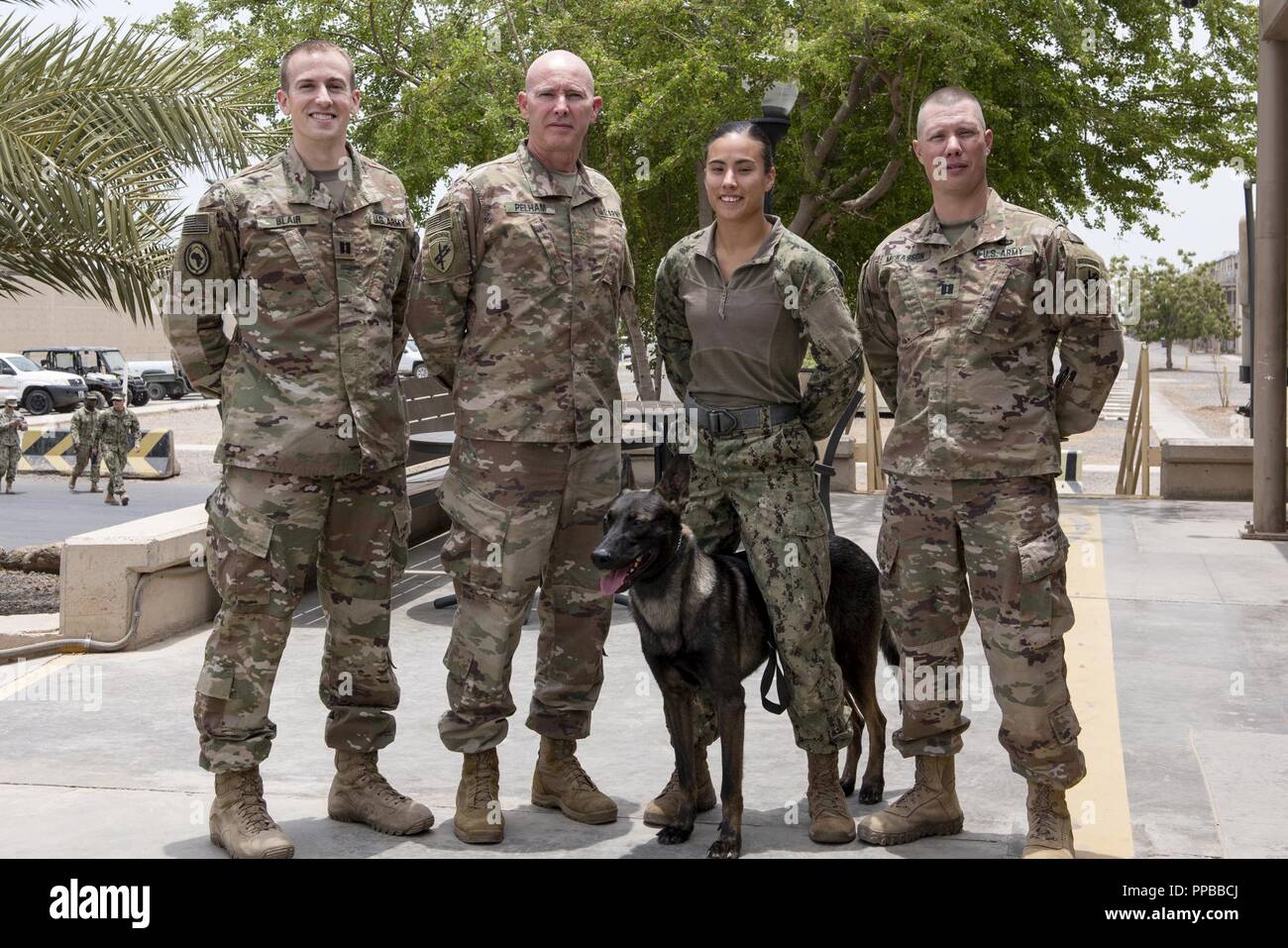 From Left U.S. Army Cpt. Richard Blair, veterinarian Maj. Steven Pelham, veterinarian, U.S