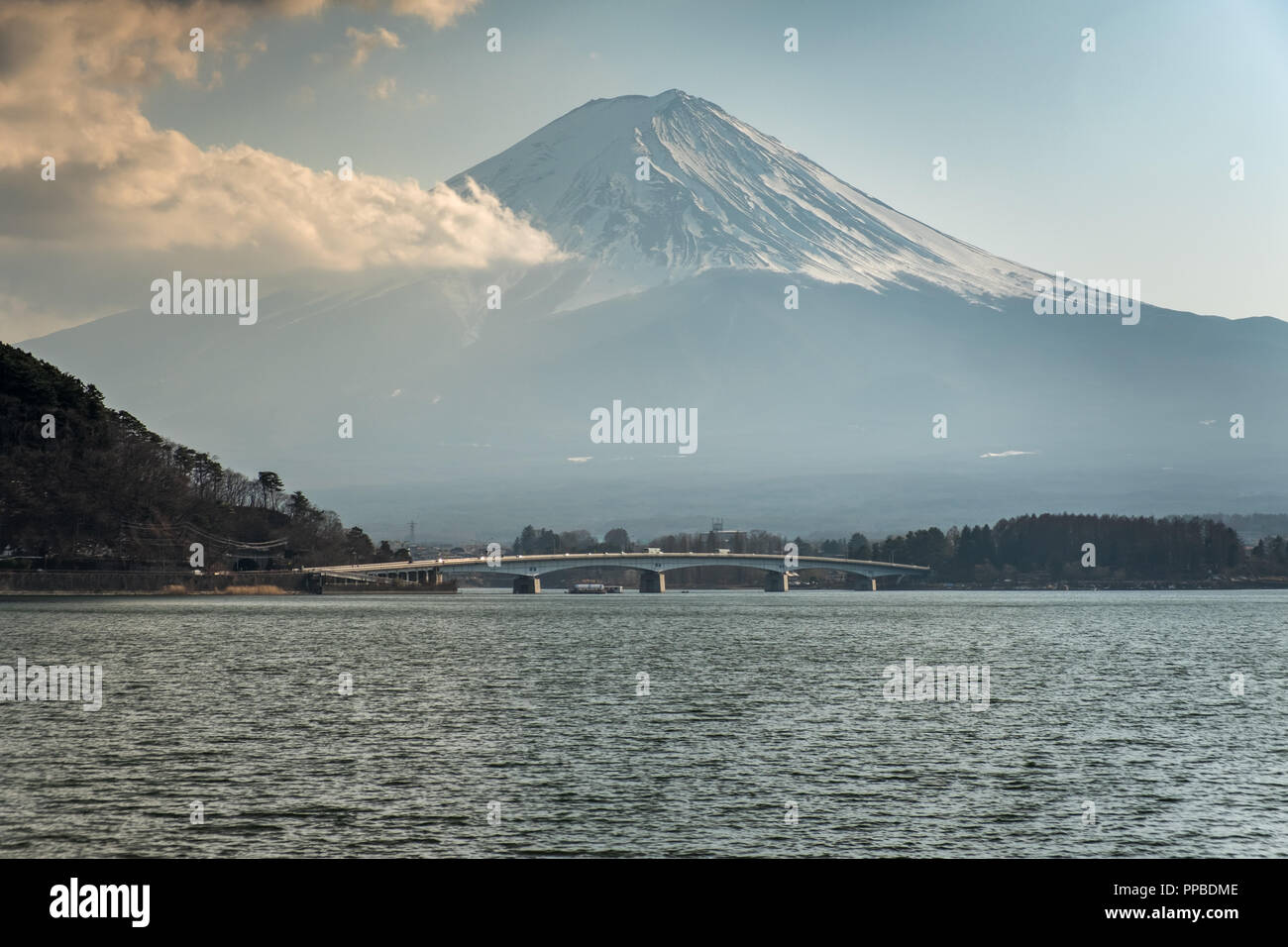 KAWAGUCHI, SAITAMA, JAPAN - 20 FEB 2018: Mount Fuji, lake Kawaguchi-ko and bridge at daytime Stock Photo