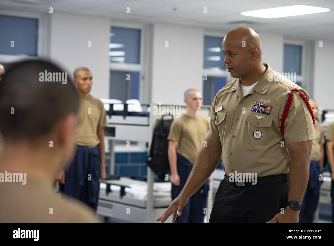 GREAT LAKES, Ill. (Aug. 23, 2018) Operations Specialist 1st Class Carmelo Oquendo, a recruit division commander, introduces new recruits to Recruit Training Command (RTC). More than 30,000 recruits graduate annually from the Navy's only boot camp. Stock Photo