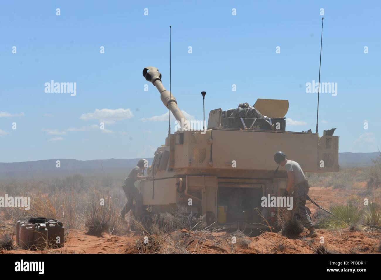 Soldiers with Bravo Battery 1113th Field Artillery Regiment check