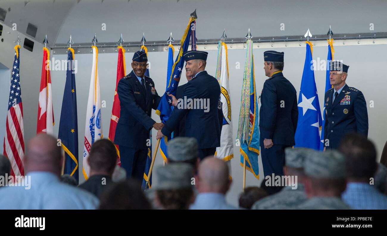 U.S. Air Force Lt. Gen. Tom Bussiere takes command of Alaskan North American Aerospace Defense Command, Alaskan Command, and the Eleventh Air Force from outgoing commander, Lt. Gen. Ken Wilsbach, during a change of command ceremony held in Hangar 1 at Joint Base Elmendorf-Richardson, Alaska, Aug. 24, 2018. Family, friends, Arctic warriors and civic leaders from the surrounding communities attended the ceremony that was jointly-officiated by Air Force Gen. Terrence J. O’Shaughnessy, commander of the United States Northern Command and North American Aerospace Defense Command, and Gen. Charles Q. Stock Photo