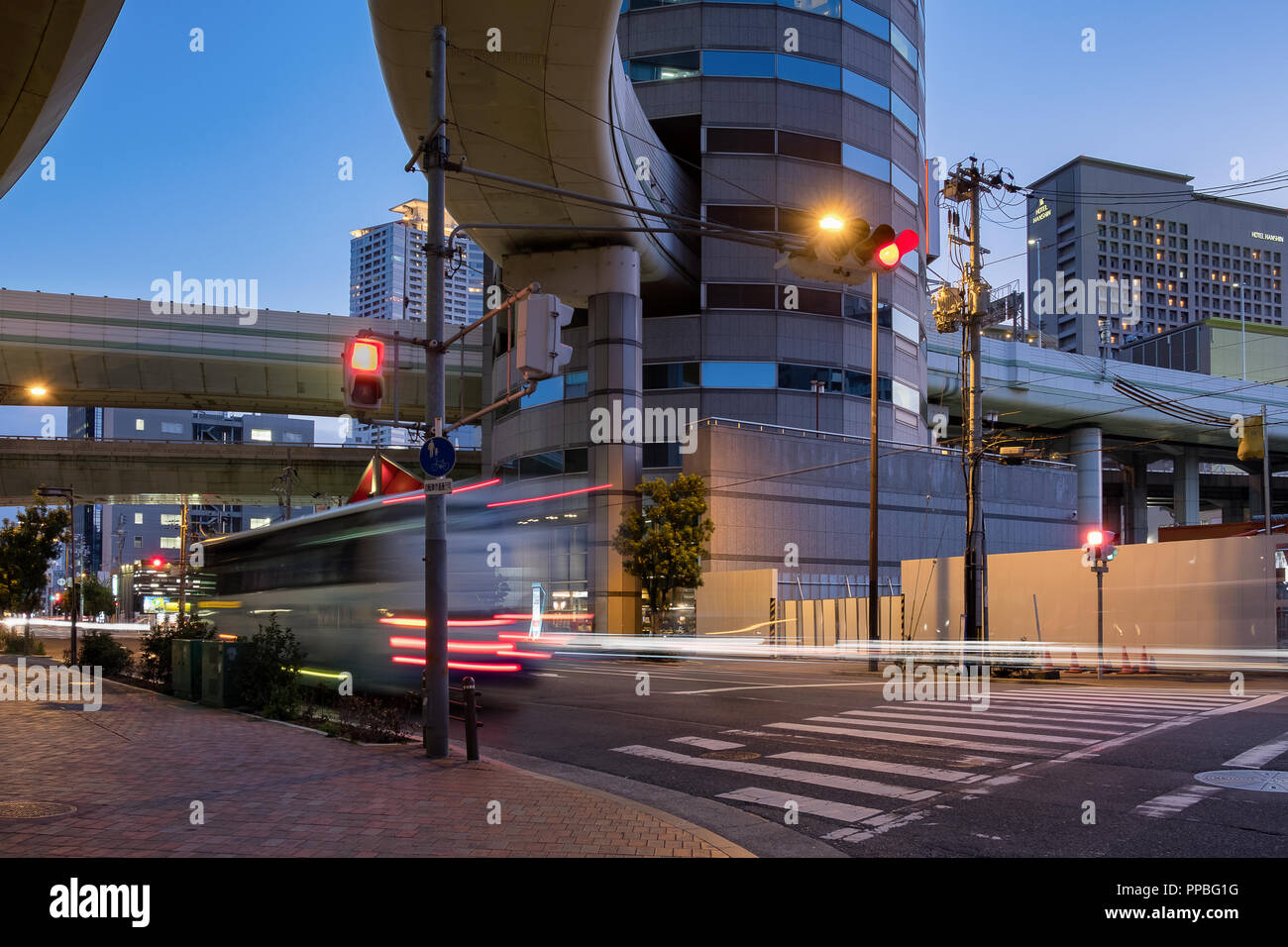 TOKYO, JAPAN - 29 JAN 2018: Gate tower building in Osaka It is notable for the highway offramp at Umeda Exit that passes through. Long exposure shot f Stock Photo