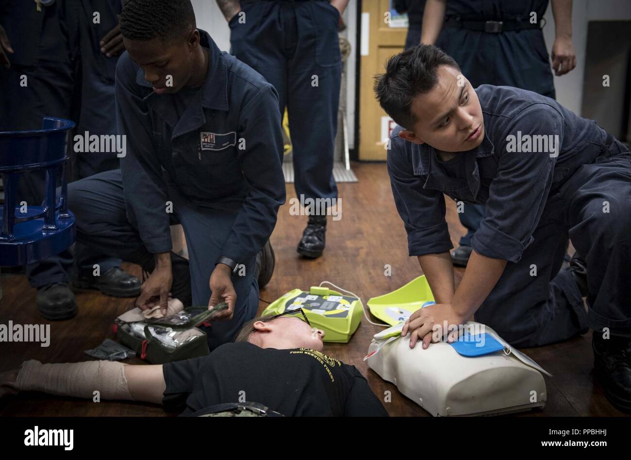 SEA (Aug. 28, 2018) Sailors participate in a medical training exercise aboard the Arleigh Burke-class guided-missile destroyer USS Carney (DDG 64) Aug. 28, 2018. Carney, forward-deployed to Rota, Spain, is on its fifth patrol in the U.S. 6th Fleet area of operations in support of regional allies and partners as well as U.S. national security interests in Europe and Africa. Stock Photo