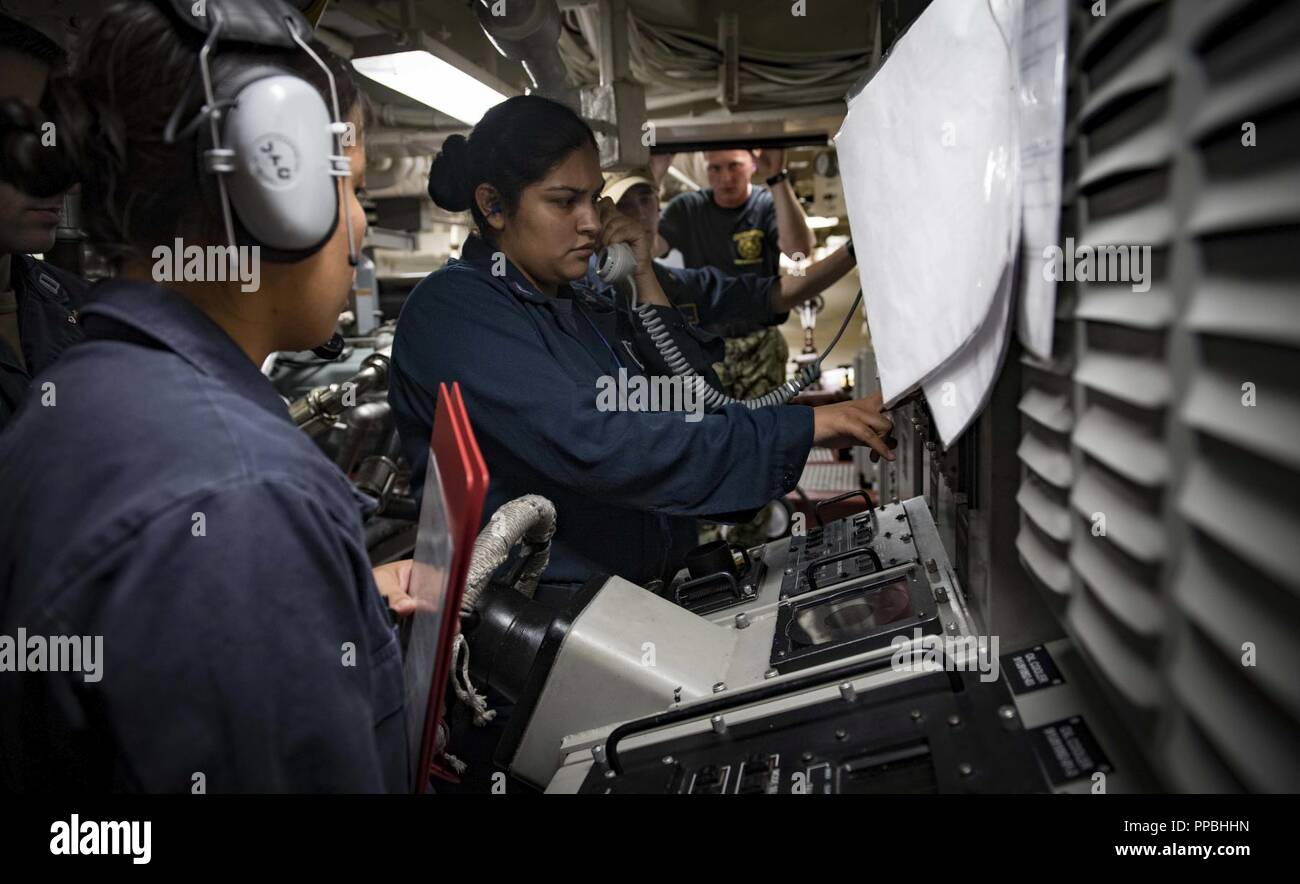 SEA (Aug. 28, 2018) Sailors man the aft-steering station during a loss of steering drill aboard the Arleigh Burke-class guided-missile destroyer USS Carney (DDG 64) Aug. 28, 2018. Carney, forward-deployed to Rota, Spain, is on its fifth patrol in the U.S. 6th Fleet area of operations in support of regional allies and partners as well as U.S. national security interests in Europe and Africa. Stock Photo