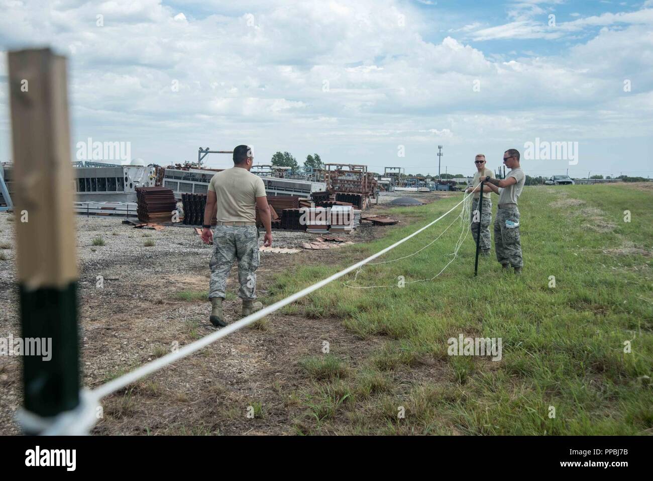 The Dirt Boys of 22nd Civil Engineer Squadron tie rope to posts Aug. 28