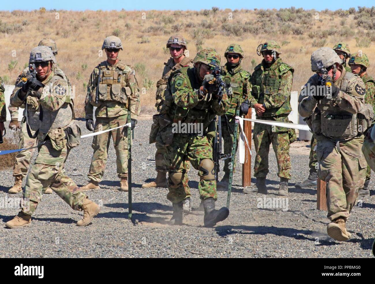 American Soldiers from 1st Battalion, 17th Infantry Regiment, along ...