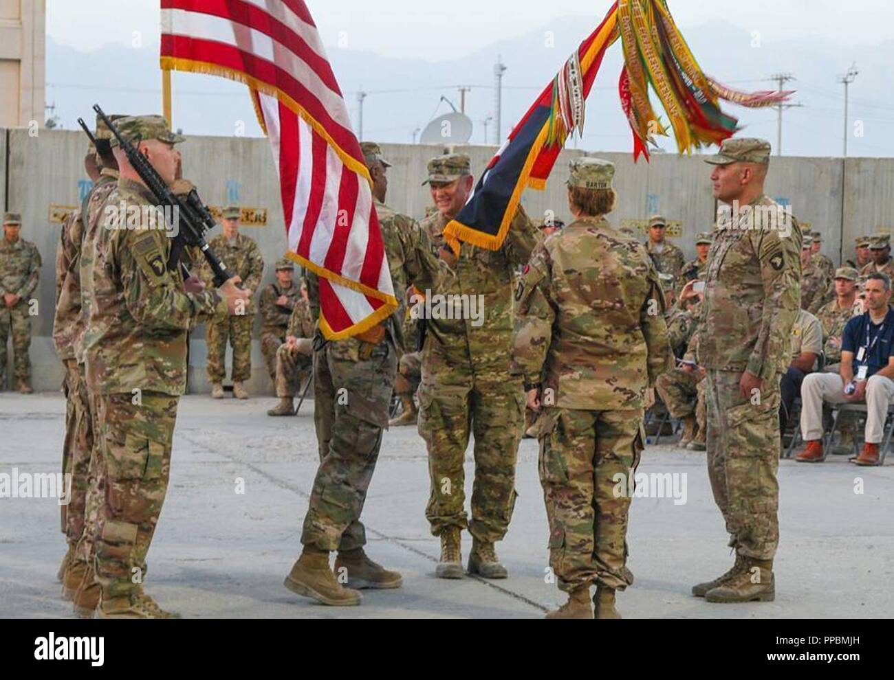 Command Sgt. Maj. Anthony McAdoo passes the Brigade guidon to the ...