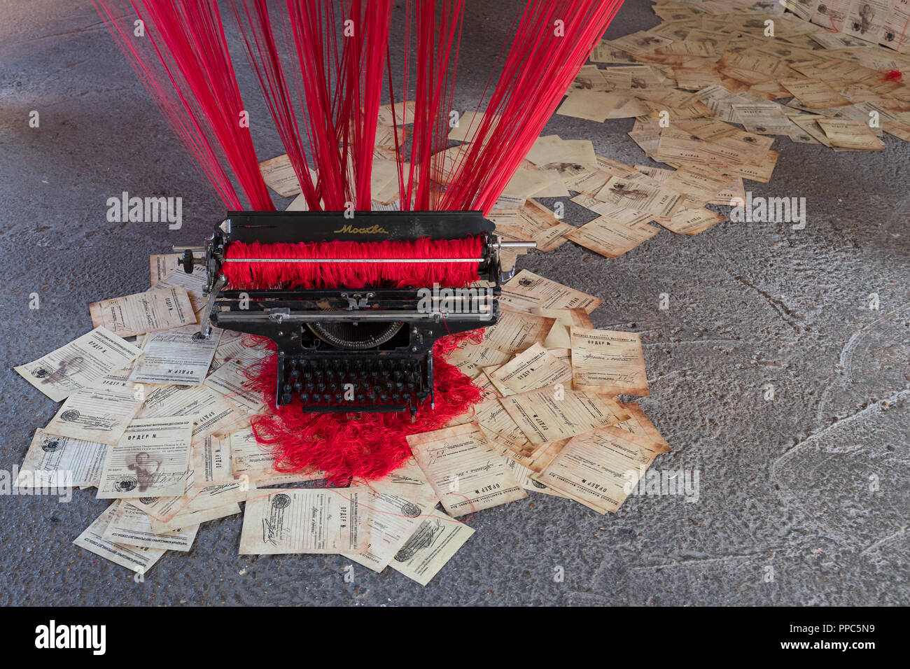 London, UK. 25th September 2018. Machine by Asel Kadyrkhanova, which commemorates millions of nameless victims of the Great Purge in the USSR in the 1930’s, by displaying thousands of arrest warrants with erased data, posing questions of individual participation in collective violence. Credit: Vickie Flores/Alamy Live News Stock Photo