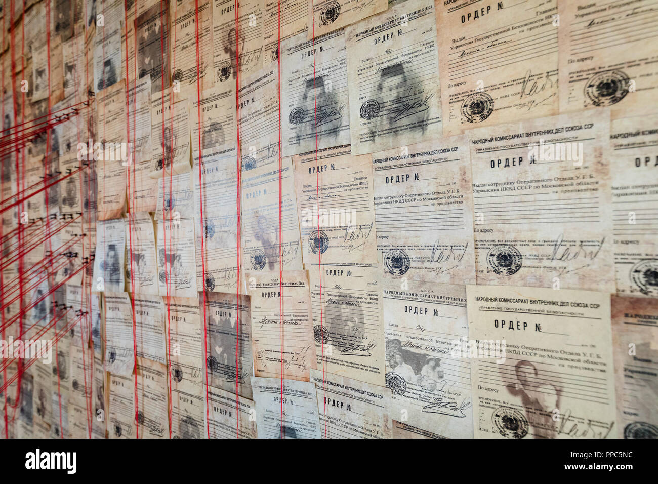 London, UK. 25th September 2018. Detail within Machine by Asel Kadyrkhanova, which commemorates millions of nameless victims of the Great Purge in the USSR in the 1930’s, by displaying thousands of arrest warrants with erased data, posing questions of individual participation in collective violence. Credit: Vickie Flores/Alamy Live News Stock Photo