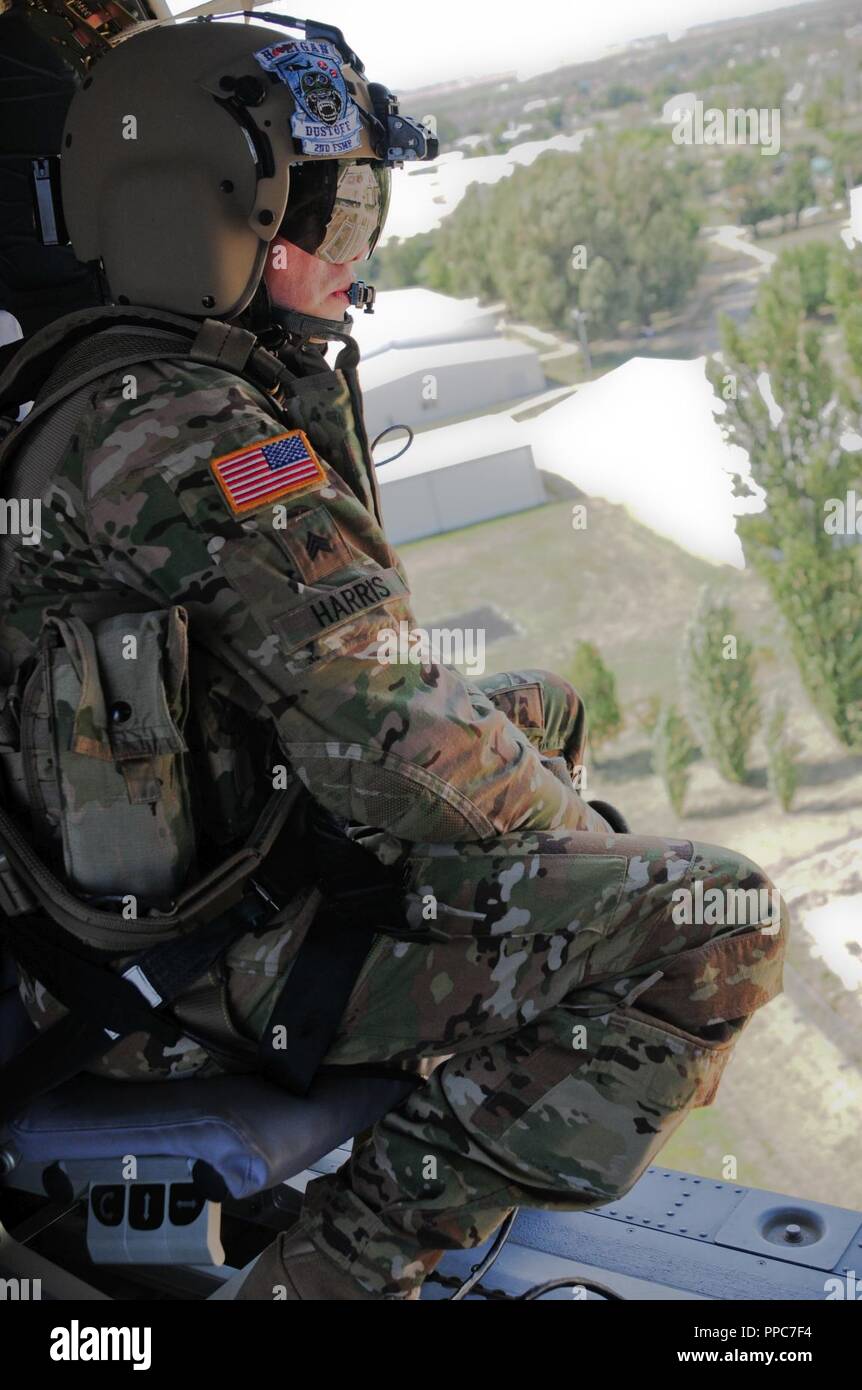 U.S. Army Sgt. Grayson Harris the medevac flight medic assisting ...