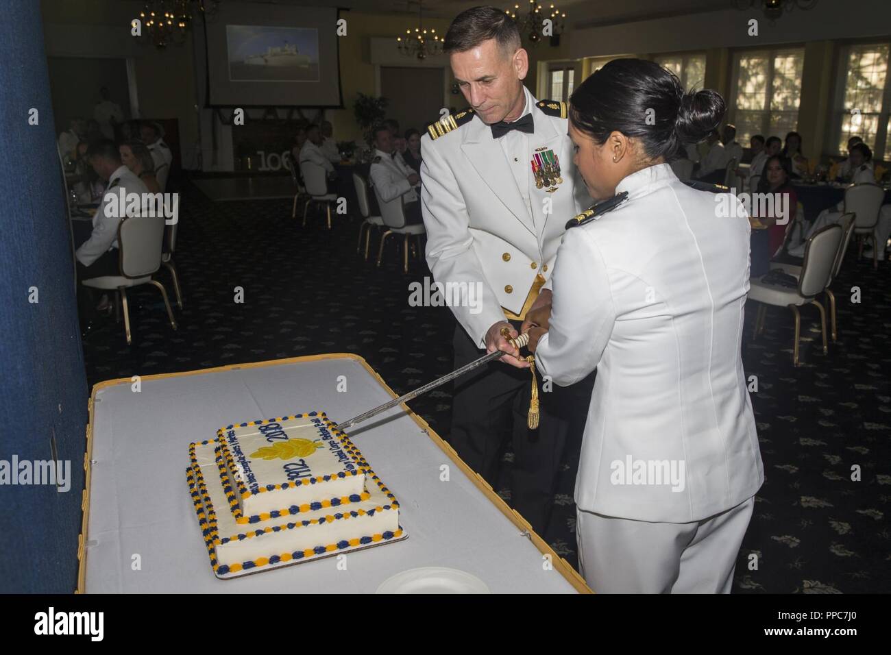 U.S. Navy Capt. Patrick W. McNally and Lt. Carissa L. Cerna, with 2d
