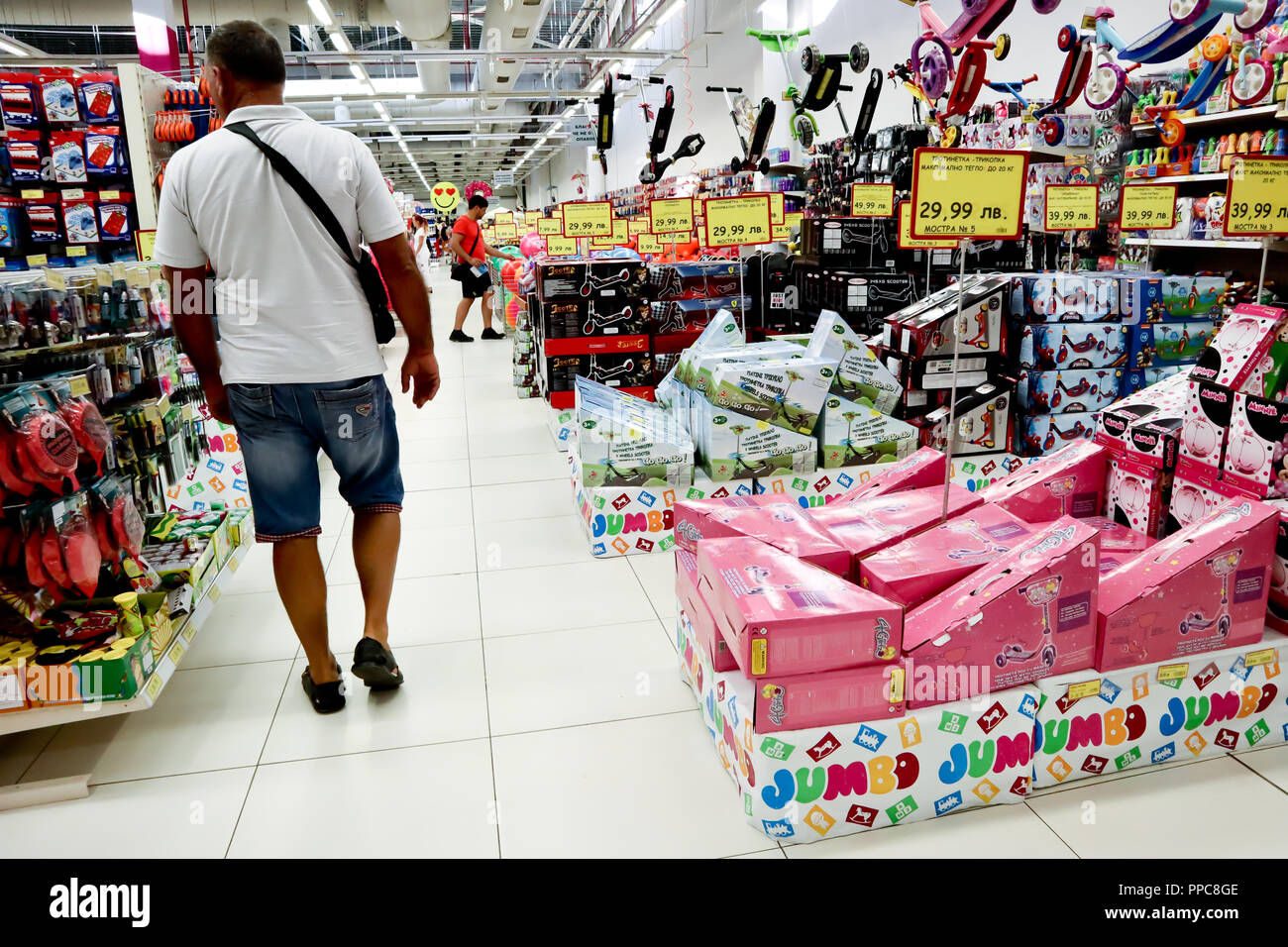 Sofia, Bulgaria, August 17, 2018: customers in toy department, scooters for  kids on sale in big supermarket Jumbo Stock Photo - Alamy