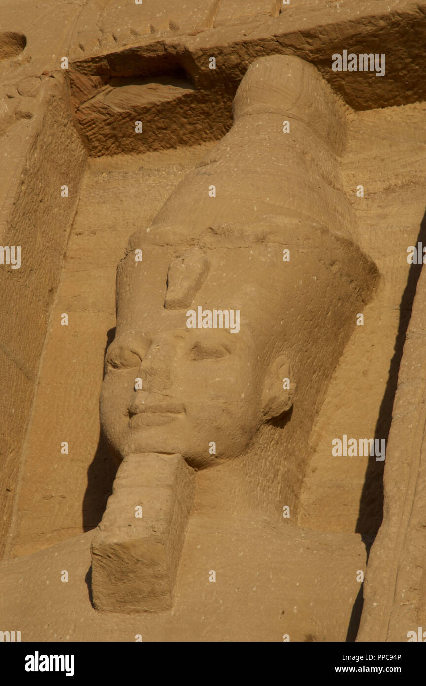 Egyptian art. Temple of Hathor or Small Temple dedicated to Nefertari. Facade depicting the pharaoh Ramses II (1290-1224 BC) with double crown and false beard. 19th dynasty. New Kingdom. Abu Simbel. Egypt. Stock Photo