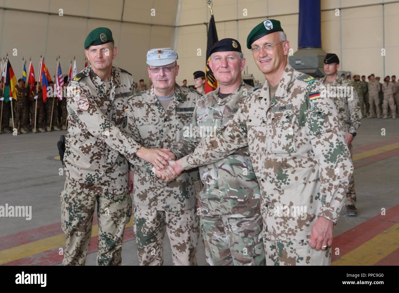 German Army Brig. Gen. Ernst-Peter Klaffus (from left), German Army Lt. Gen. Erich Pfeffer, British Army Lt. Gen. Richard Cripwell and German Army Brig. Gen. Wolf-Jürgen Stahl pose for a photo after the transfer of authority ceremony at TAAC-North on August 21, 2018 in Mazar-e Sharif, Afghanistan. Klaffus is the incoming commander for TAAC-North. Stock Photo