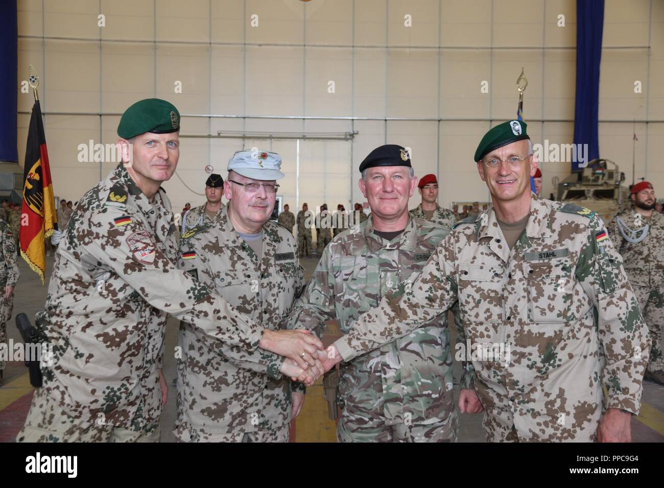 German Army Brig. Gen. Ernst-Peter Klaffus (from left), German Army Lt. Gen. Erich Pfeffer, British Army Lt. Gen. Richard Cripwell and German Army Brig. Gen. Wolf-Jürgen Stahl pose for a photo after the transfer of authority ceremony at TAAC-North on August 21, 2018 in Mazar-e Sharif, Afghanistan. Klaffus is the incoming commander for TAAC-North. Stock Photo