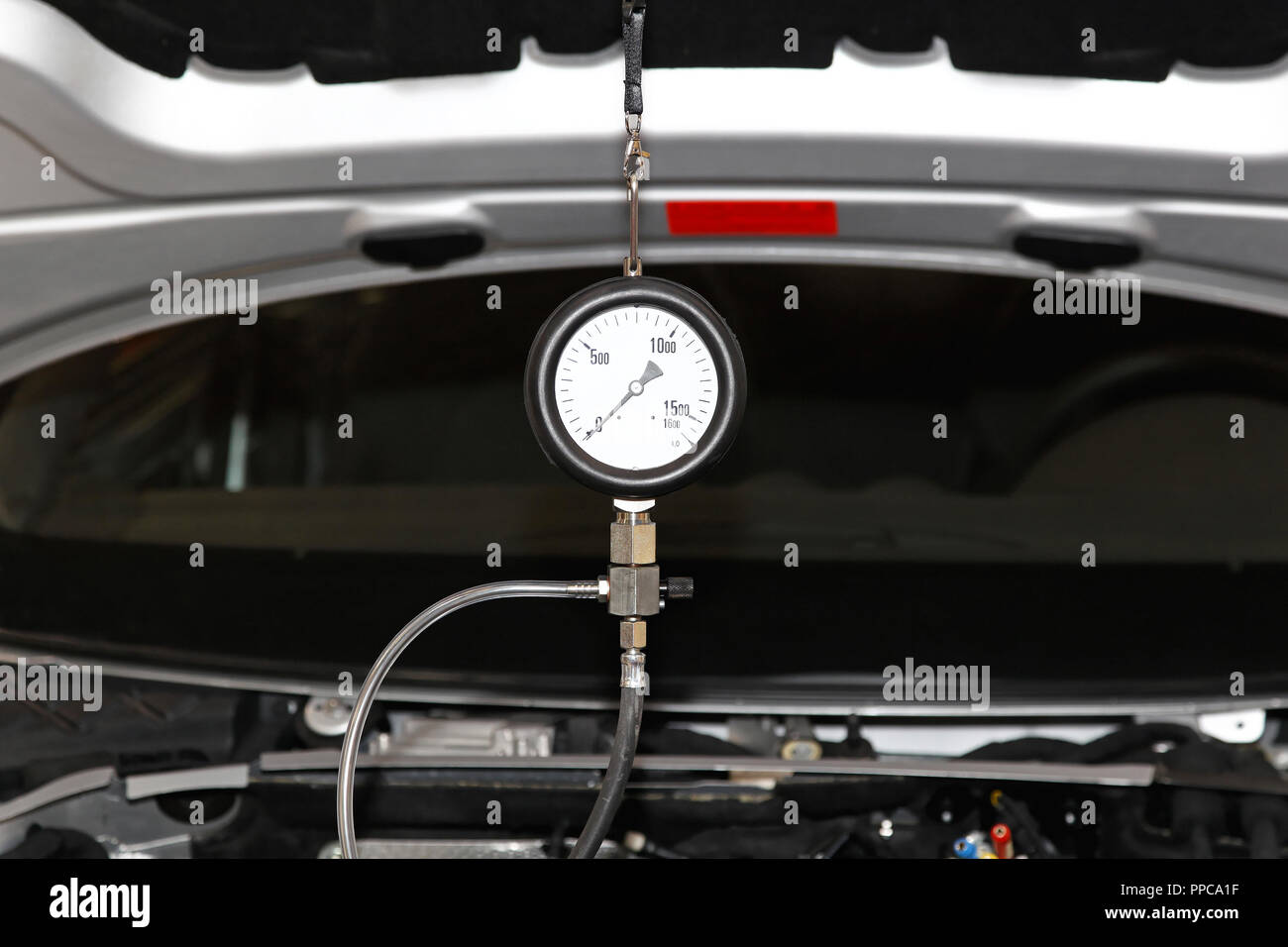 Petrol engine automotive compression test gauge service Stock Photo Alamy