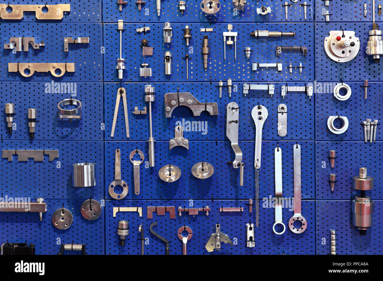 Special tools at wall in auto service garage Stock Photo Alamy