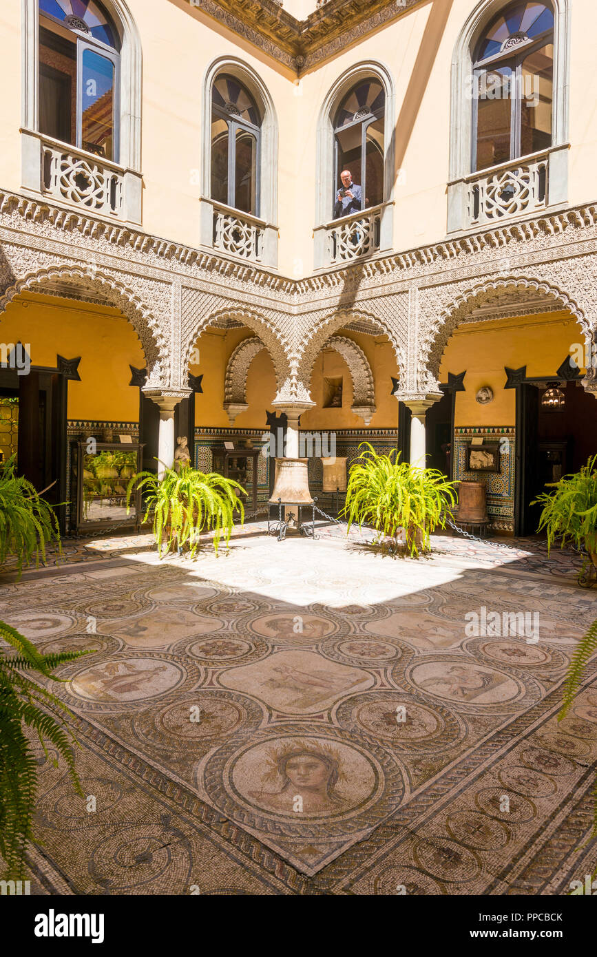 16th century palace, Moorish architecture, courtyard decorated with Roman mosaic, sculptures, Palacio de la Condesa de Lebrija Stock Photo