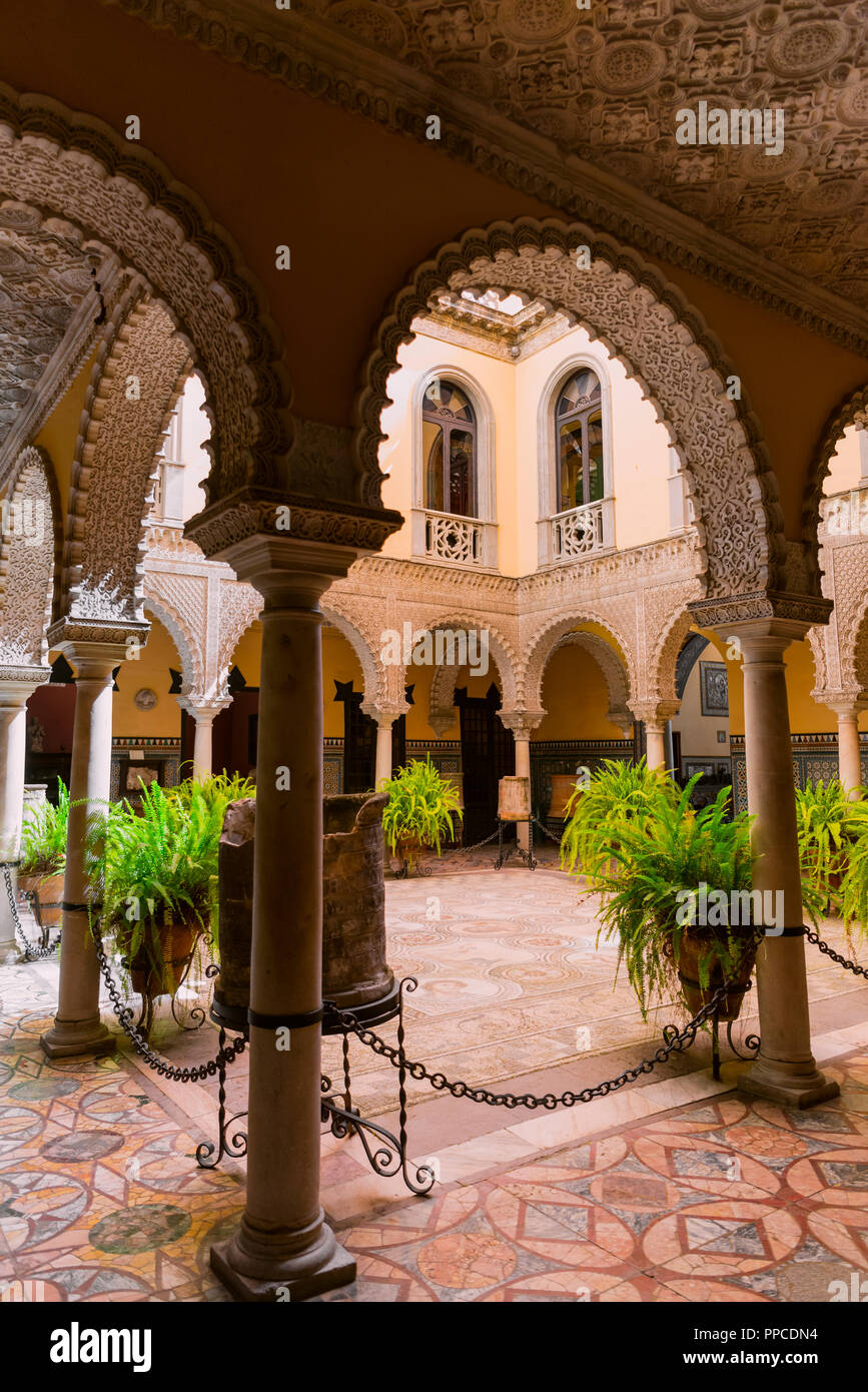 16th century palace with Arabian architecture, courtyard with artistic arcade and Roman mosaic, Palacio de la Condesa de Lebrija Stock Photo