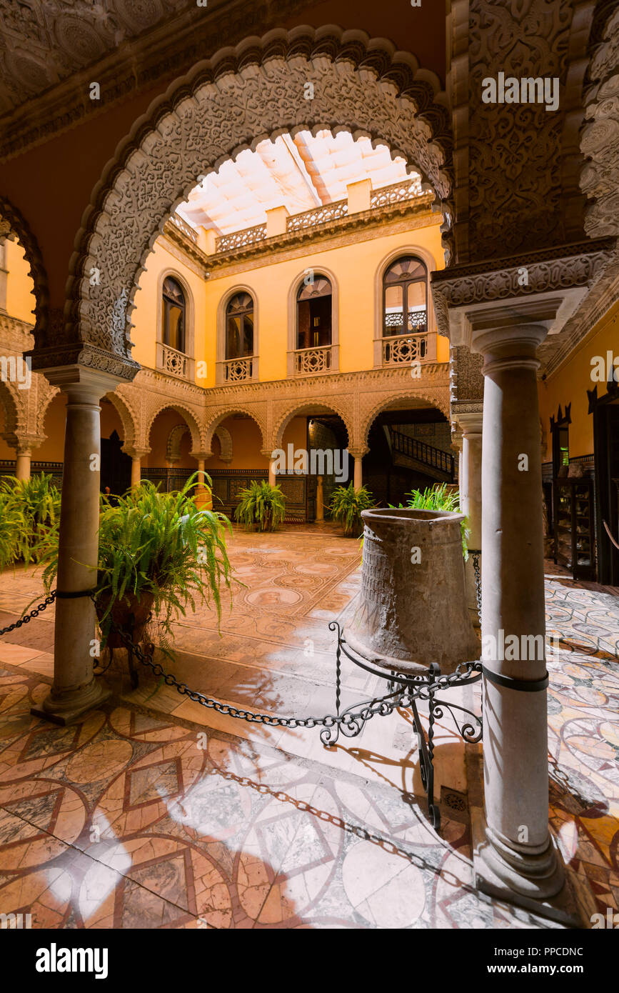 16th century palace with Arabian architecture, courtyard with artistic arcade and Roman mosaic, Palacio de la Condesa de Lebrija Stock Photo