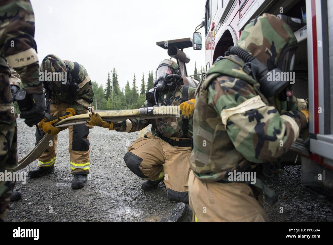 U.S. Air Force fire protection specialists assigned to the 673d Civil