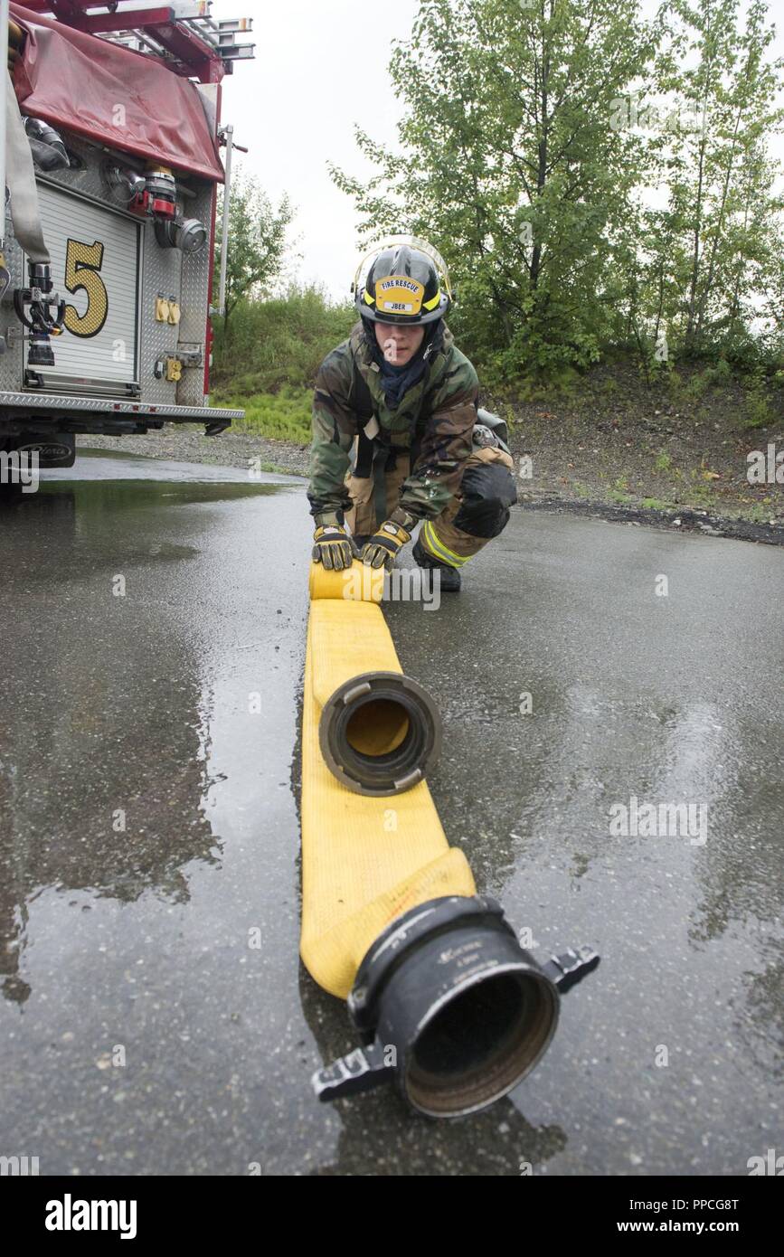 A U.S. Air Force Airman 1st Class Nicholas Coury, a fire protection specialists assigned to the