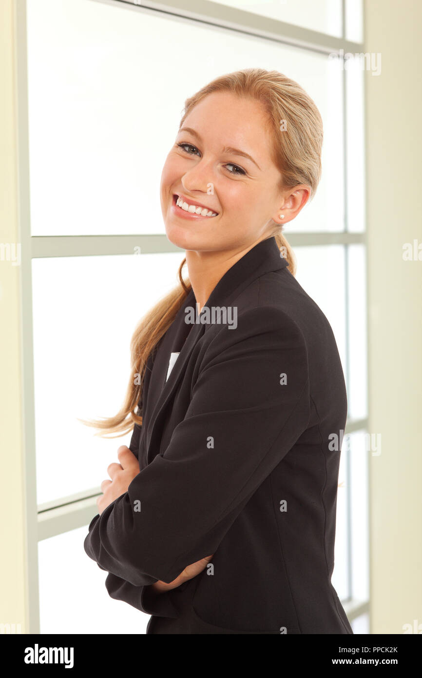 Portrait of young girl in business suit Stock Photo - Alamy