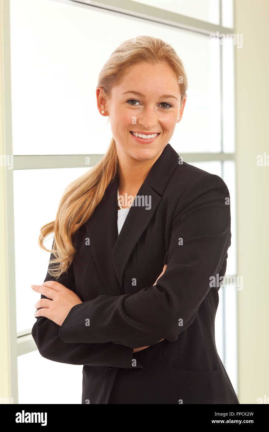 Portrait of young girl in business suit Stock Photo - Alamy