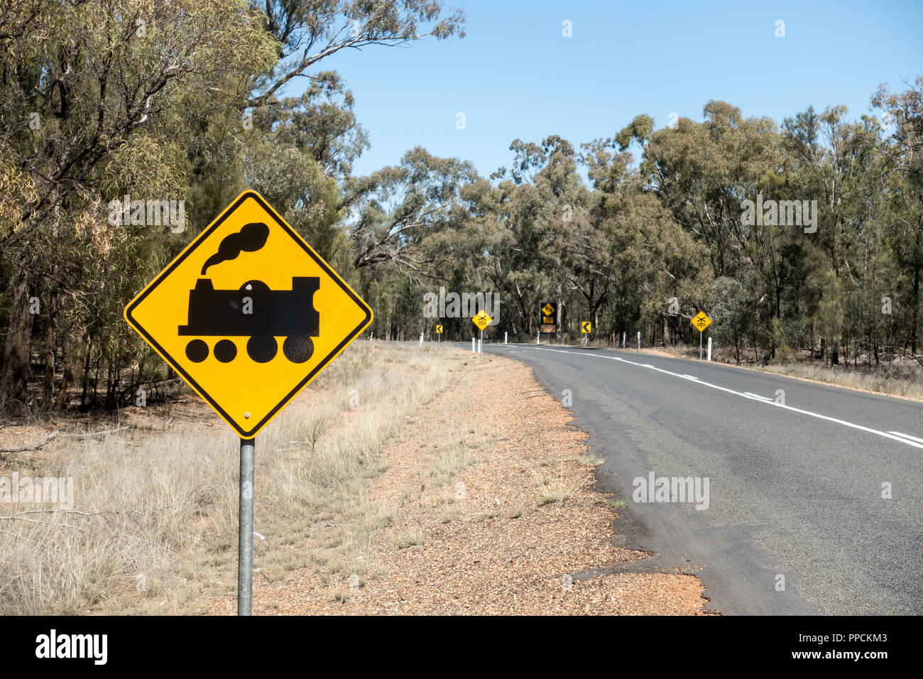 Railroad crossing ahead traffic sign. Rural NSW Australia. Stock Photo