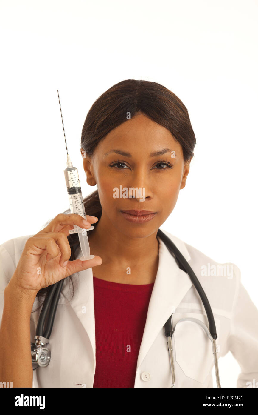 Close up of young female medical doctor holding needle injection with