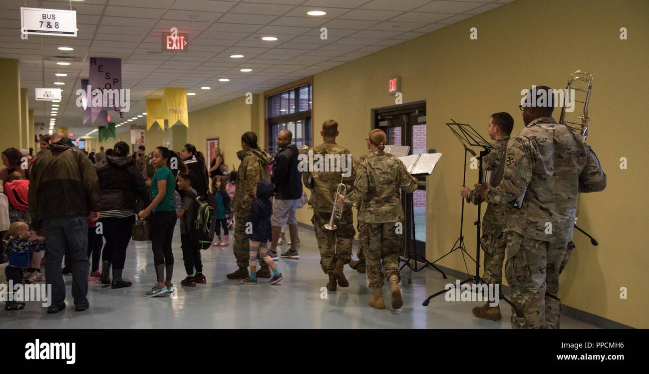 CAMP HUMPHREYS, Republic of Korea— Students, family and the Eighth Army Band fill the hallway of Humphreys Central Elementary School for the first day of school, August 27. Schools on Camp Humphreys opened their doors on August 27 for the 2018-2019 school year welcoming new and returning students, faculty and accompanied family members. Stock Photo