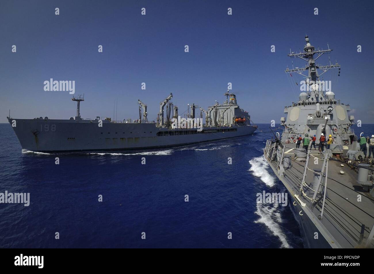 SEA (Aug. 30, 2018) The Arleigh Burke-class guided-missile destroyer USS Carney (DDG 64) conducts a replenishment at sea with the fleet replenishment oiler USNS Big Horn (T-AO 198) Aug. 30, 2018. Carney, forward-deployed to Rota, Spain, is on its fifth patrol in the U.S. 6th Fleet area of operations in support of regional allies and partners as well as U.S. national security interests in Europe and Africa. Stock Photo