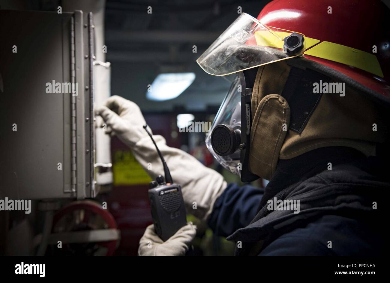 SEA (Aug. 31, 2018) Damage Controlman 2nd Class Kristopher Rejcek operates a ventilation panel during a general quarters drill aboard the Arleigh Burke-class guided-missile destroyer USS Carney (DDG 64) Aug. 31, 2018. Carney, forward-deployed to Rota, Spain, is on its fifth patrol in the U.S. 6th Fleet area of operations in support of regional allies and partners as well as U.S. national security interests in Europe and Africa. Stock Photo