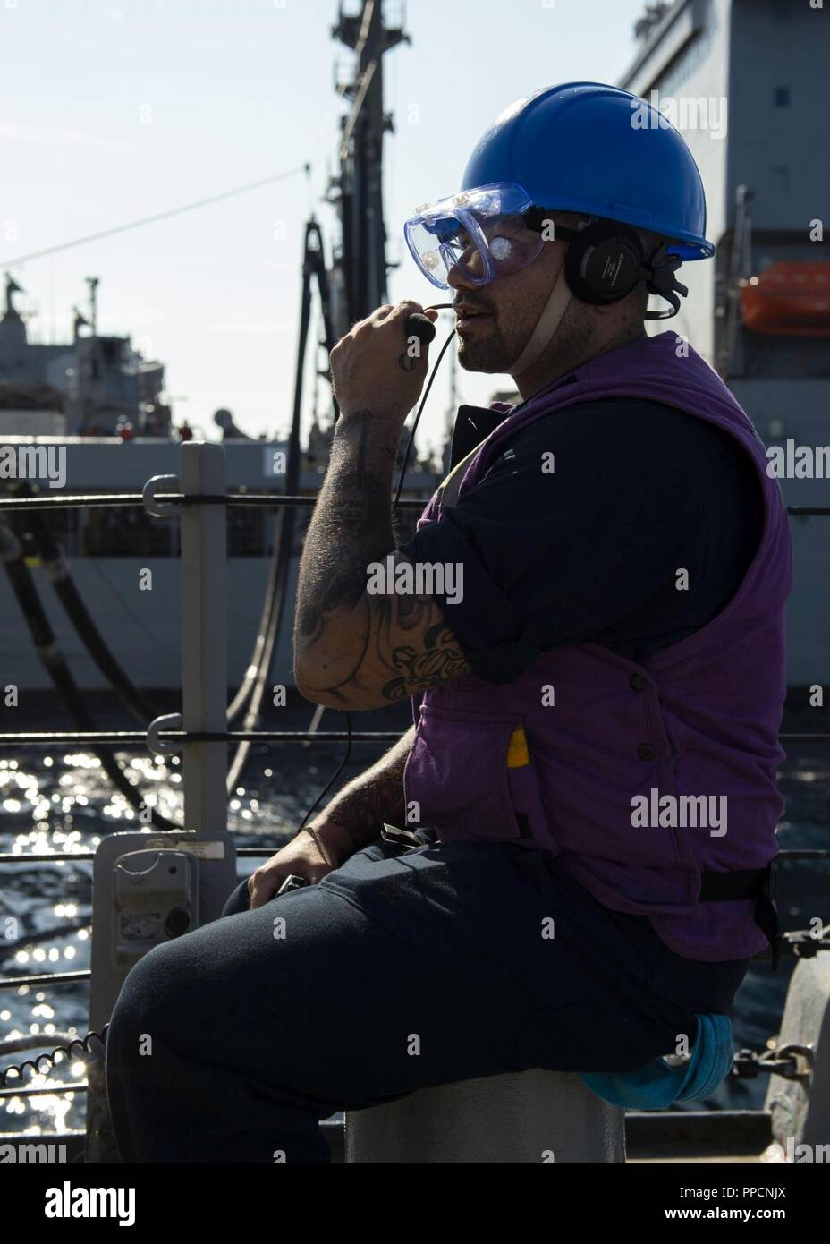 ATLANTIC OCEAN (Sep. 1, 2018) Gas Turbine Systems Technician (Mechanical) 3rd Class William Cloninger monitors refueling operations at a underway replenishment station aboard the guided-missile destroyer USS Arleigh Burke (DDG 51) during a replenishment-at-sea with the Military Sealift Command’s fleet replenishment oiler USNS John Lenthall (T-AOE 189). Arleigh Burke is currently deployed as part of the Harry S. Truman Carrier Strike Group. Harry S. Truman will continue its deployment by conducting sustainment operations in the Atlantic. Stock Photo