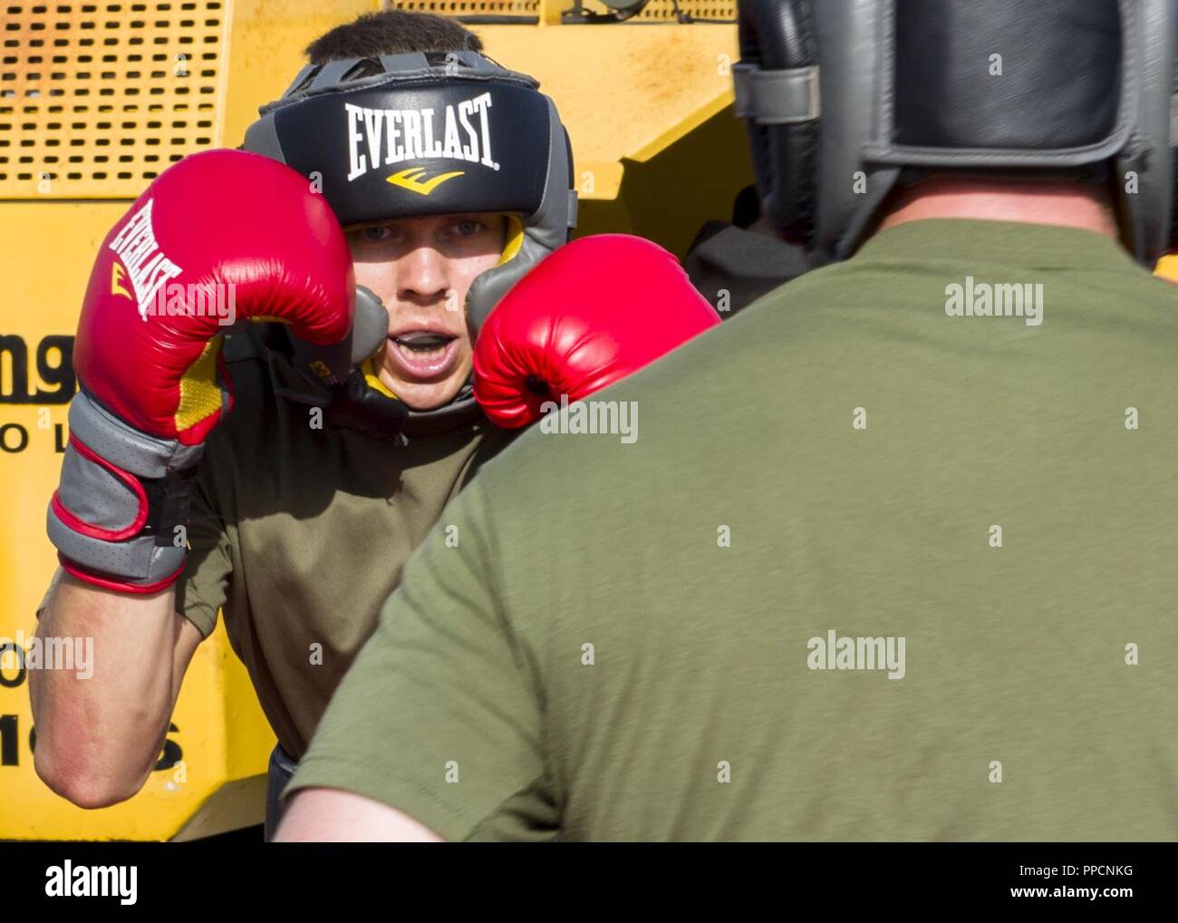 INDIAN OCEAN (Aug. 31, 2018) Marine Corps Lance Cpl. James Solan, from Lexington, N.C., assigned to 13th Marine Expeditionary Unit (MEU), participates in Marine Corps Martial Arts Program on the flight deck of San Antonio-class amphibious transport dock USS Anchorage (LPD 23) during a regularly scheduled deployment of Essex Amphibious Ready Group (ARG) and 13th MEU. The Essex ARG/13th MEU is a lethal, flexible, and persistent Navy-Marine Corps team deployed to the U.S. 5th Fleet area of operations in support of naval operations to ensure maritime stability and security in the Central Region, c Stock Photo