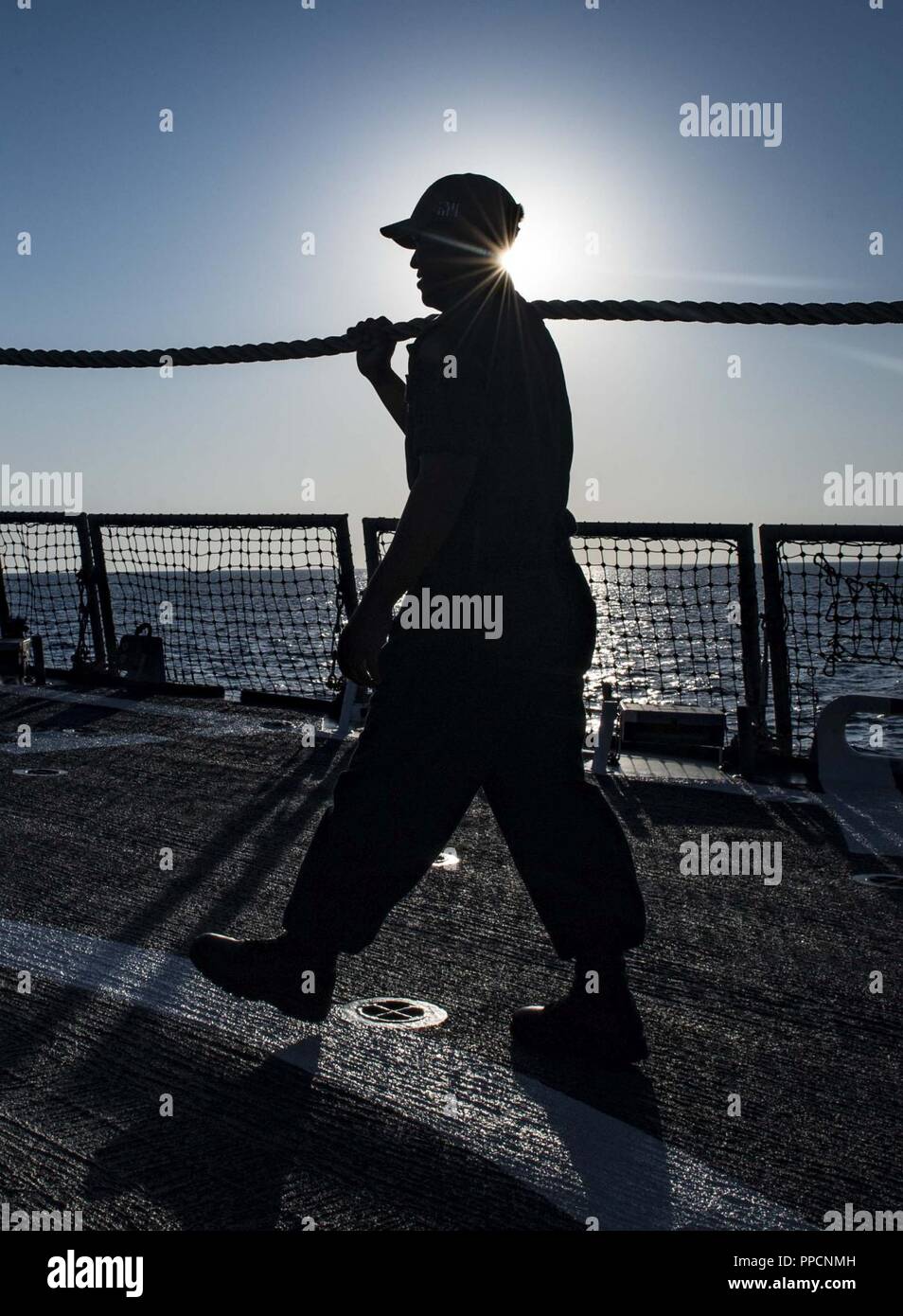 BAY, Greece (Sept. 2, 2018) Boatswain’s Mate 3rd Class Amari Jessup handles line aboard the Arleigh Burke-class guided-missile destroyer USS Carney (DDG 64) as the ship arrives in Souda Bay, Greece, Sept. 2, 2018. Carney, forward-deployed to Rota, Spain, is on its fifth patrol in the U.S. 6th Fleet area of operations in support of regional allies and partners as well as U.S. national security interests in Europe and Africa. Stock Photo