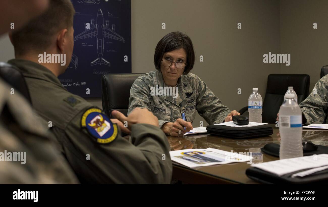 U.S. Air Force Col. Jacqueline D. Breeden, 305th Air Mobility Wing commander, discusses problem areas, expectations and mission requirements with 305th AMW leaders at the Combined Maintenance Operations Facility at Joint Base McGuire-Dix-Lakehurst, N.J., Sept. 6, 2018. Breeden went on an immersion tour with the 6th Airlift Squadron to hear from Airmen firsthand what issues they are facing in their daily specialties and also to congratulate and award those who worked hard to stand out amongst their peers. Stock Photo