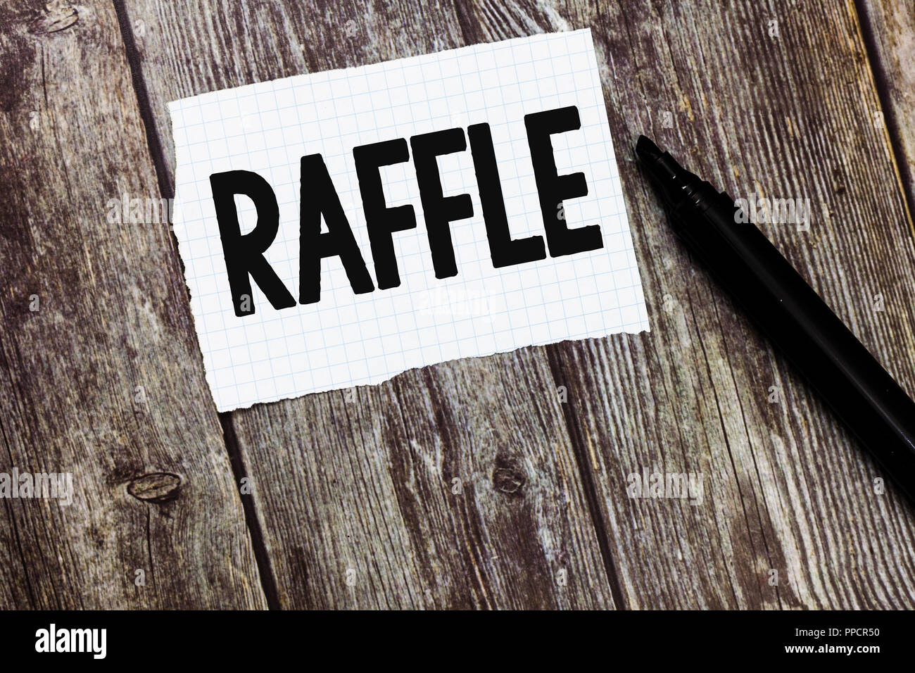 Text sign showing Raffle. Conceptual photo means of raising money by selling numbered tickets offer as prize. Stock Photo