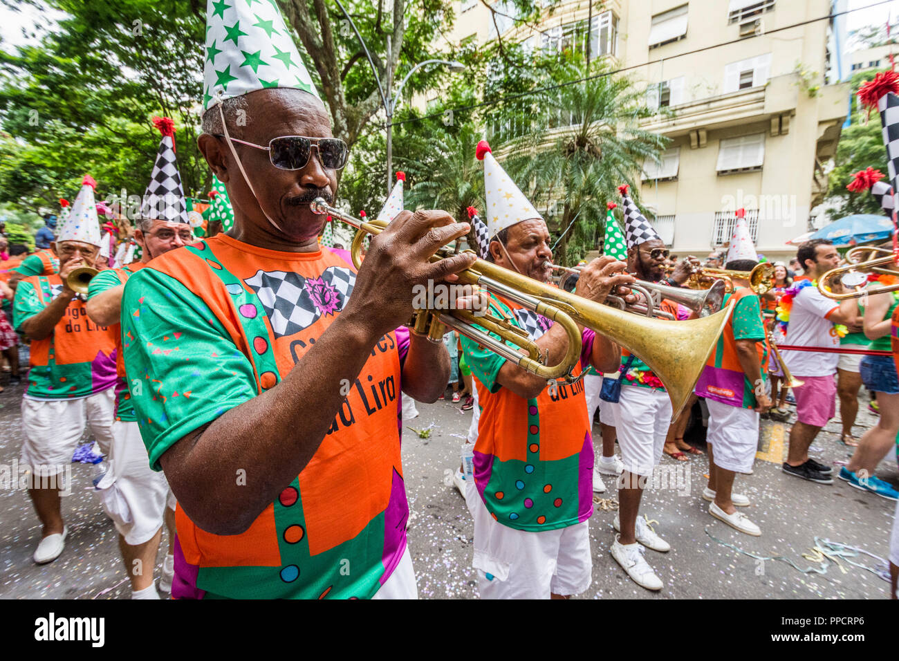 Carnival street parade of men playing trumpets in Laranjeiras neighborhood, Rio de Janeiro, Brazil Stock Photo